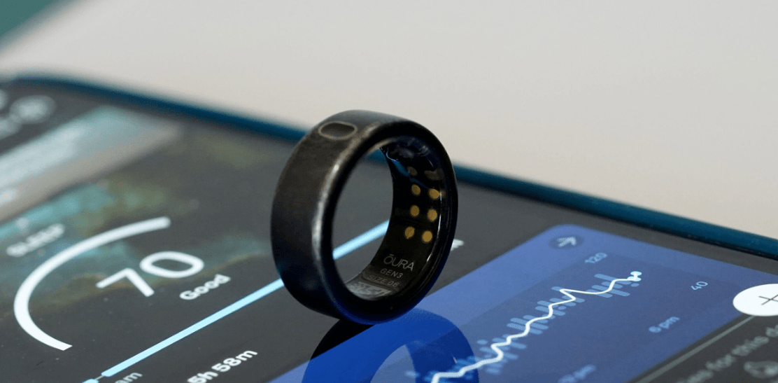 Oura Ring 4 smart ring on finger with app showing AI readiness score and sleep staging breakdown
